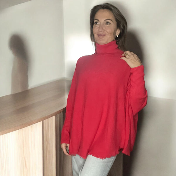 Pull corail col roulé à Franges