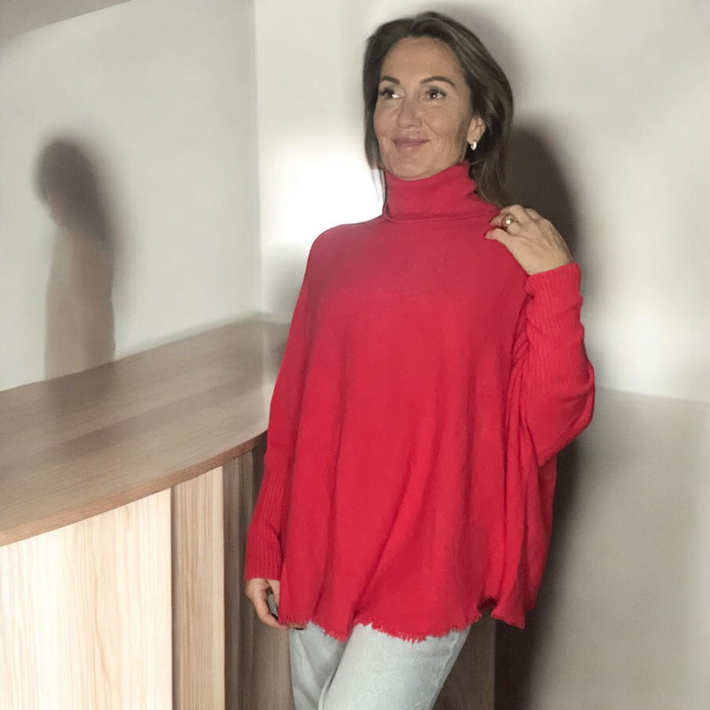 Pull corail col roulé à Franges