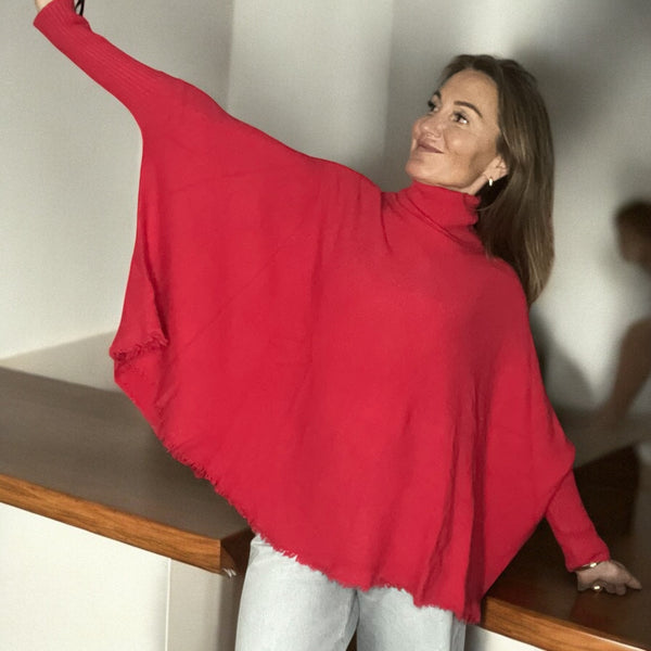 Pull corail col roulé à Franges